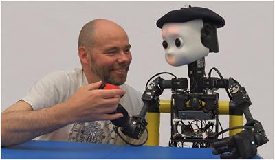 Teaching NICO How to Grasp: An Empirical Study on Crossmodal Social Interaction as a Key Factor for Robots Learning From Humans